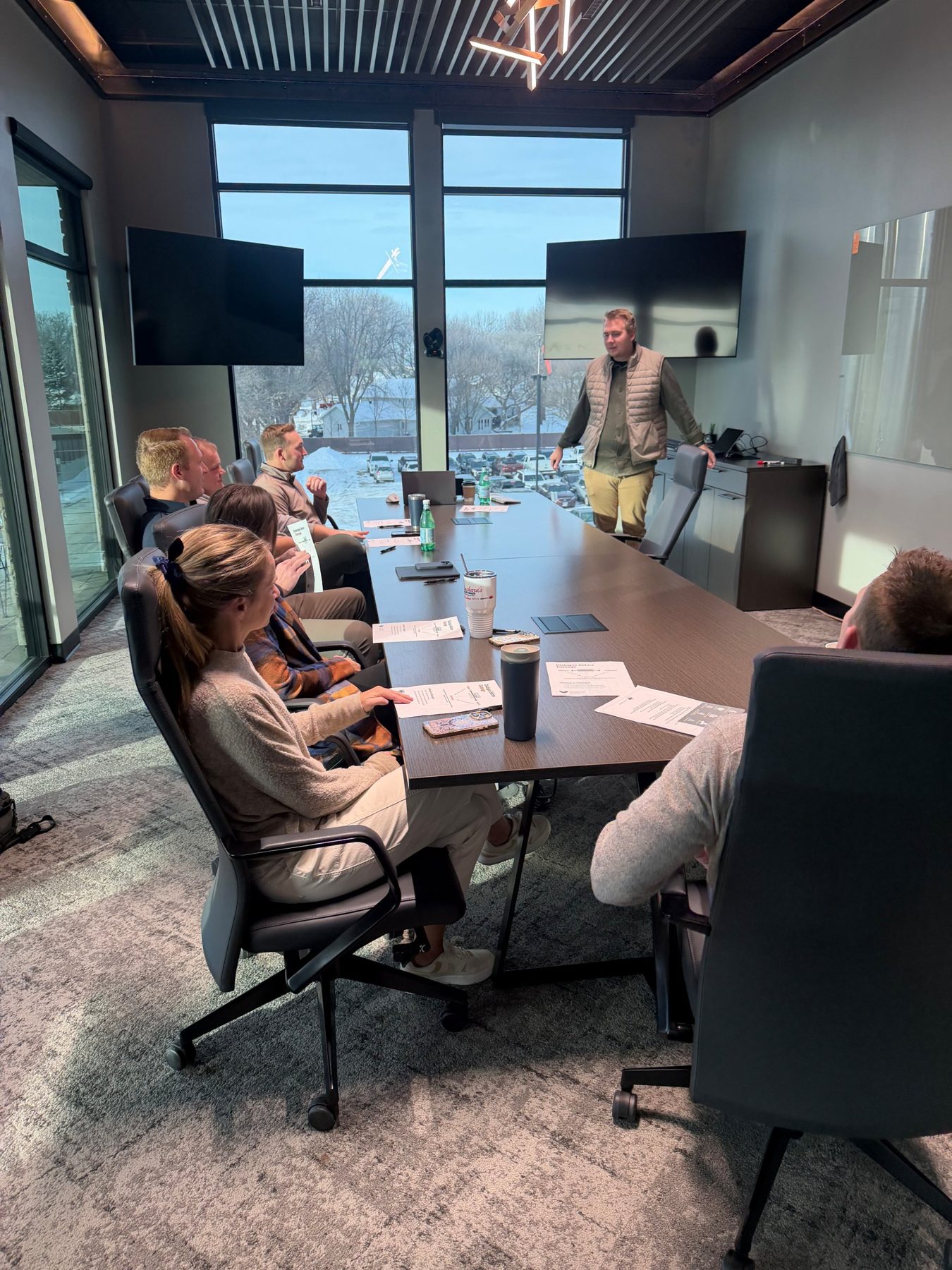 Andy Bergmann leading a session with the Black Kanyon team in a conference room